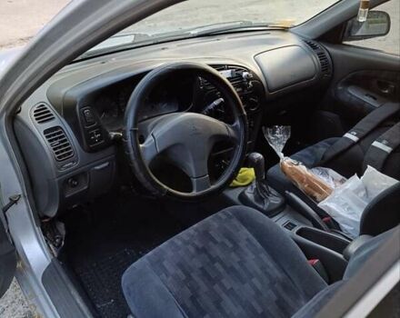 Сірий Міцубісі Lancer, об'ємом двигуна 1.3 л та пробігом 371 тис. км за 990 $, фото 6 на Automoto.ua