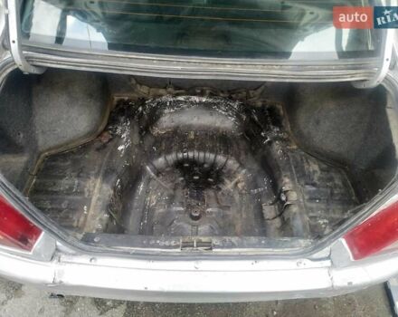 Серый Мицубиси Лансер, объемом двигателя 1.3 л и пробегом 367 тыс. км за 1050 $, фото 9 на Automoto.ua