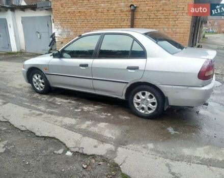 Серый Мицубиси Лансер, объемом двигателя 1.3 л и пробегом 367 тыс. км за 1050 $, фото 2 на Automoto.ua