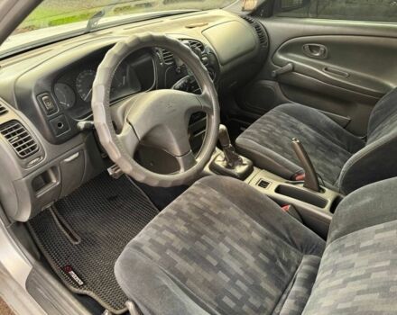 Серый Мицубиси Лансер, объемом двигателя 1.3 л и пробегом 300 тыс. км за 1000 $, фото 4 на Automoto.ua