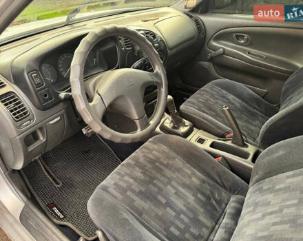 Сірий Міцубісі Lancer, об'ємом двигуна 1.3 л та пробігом 302 тис. км за 950 $, фото 4 на Automoto.ua