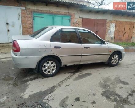 Серый Мицубиси Лансер, объемом двигателя 1.3 л и пробегом 367 тыс. км за 1050 $, фото 6 на Automoto.ua