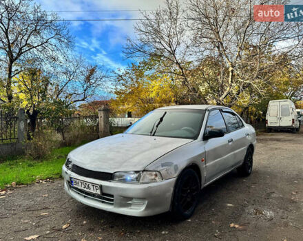 Сірий Міцубісі Lancer, об'ємом двигуна 1.3 л та пробігом 302 тис. км за 950 $, фото 1 на Automoto.ua