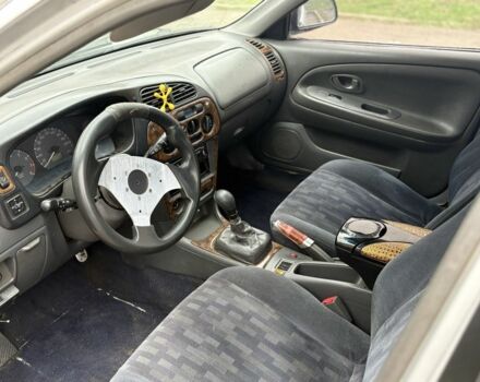 Сірий Міцубісі Lancer, об'ємом двигуна 1.3 л та пробігом 200 тис. км за 1100 $, фото 5 на Automoto.ua