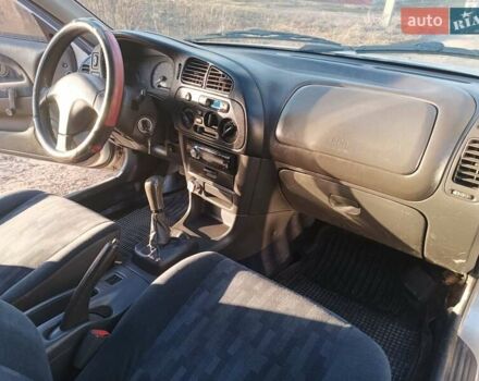 Серый Мицубиси Лансер, объемом двигателя 1.3 л и пробегом 390 тыс. км за 1800 $, фото 11 на Automoto.ua