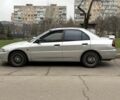 Сірий Міцубісі Lancer, об'ємом двигуна 1.3 л та пробігом 200 тис. км за 1100 $, фото 4 на Automoto.ua