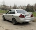 Сірий Міцубісі Lancer, об'ємом двигуна 1.3 л та пробігом 200 тис. км за 1100 $, фото 3 на Automoto.ua