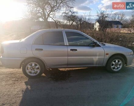 Серый Мицубиси Лансер, объемом двигателя 1.3 л и пробегом 390 тыс. км за 1800 $, фото 29 на Automoto.ua