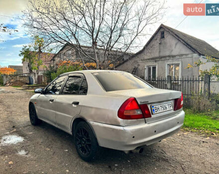 Сірий Міцубісі Lancer, об'ємом двигуна 1.3 л та пробігом 302 тис. км за 950 $, фото 3 на Automoto.ua