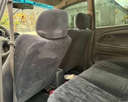 Серый Мицубиси Лансер, объемом двигателя 1.3 л и пробегом 300 тыс. км за 1000 $, фото 5 на Automoto.ua