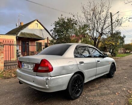 Серый Мицубиси Лансер, объемом двигателя 1.3 л и пробегом 300 тыс. км за 1000 $, фото 2 на Automoto.ua