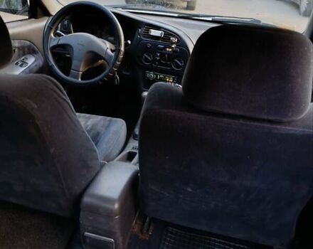 Сірий Міцубісі Lancer, об'ємом двигуна 1.3 л та пробігом 371 тис. км за 990 $, фото 5 на Automoto.ua