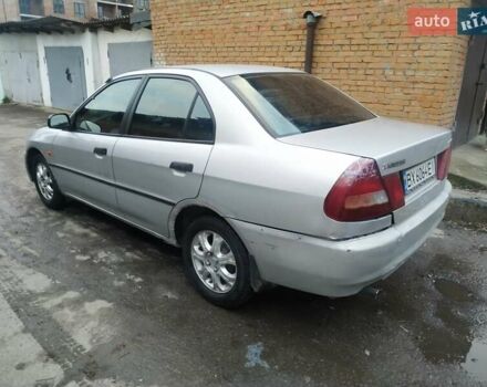 Серый Мицубиси Лансер, объемом двигателя 1.3 л и пробегом 367 тыс. км за 1050 $, фото 4 на Automoto.ua