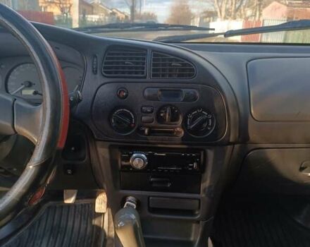 Серый Мицубиси Лансер, объемом двигателя 1.3 л и пробегом 390 тыс. км за 1800 $, фото 15 на Automoto.ua