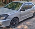 Сірий Міцубісі Lancer, об'ємом двигуна 2 л та пробігом 244 тис. км за 3497 $, фото 1 на Automoto.ua