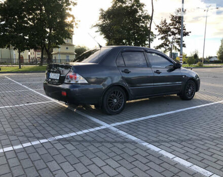 Сірий Міцубісі Lancer, об'ємом двигуна 1.58 л та пробігом 232 тис. км за 2899 $, фото 12 на Automoto.ua