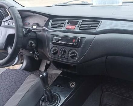 Серый Мицубиси Лансер, объемом двигателя 1.58 л и пробегом 450 тыс. км за 3200 $, фото 10 на Automoto.ua