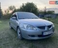 Серый Мицубиси Лансер, объемом двигателя 1.58 л и пробегом 390 тыс. км за 4400 $, фото 1 на Automoto.ua