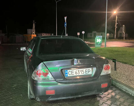 Сірий Міцубісі Lancer, об'ємом двигуна 1.58 л та пробігом 232 тис. км за 2899 $, фото 2 на Automoto.ua