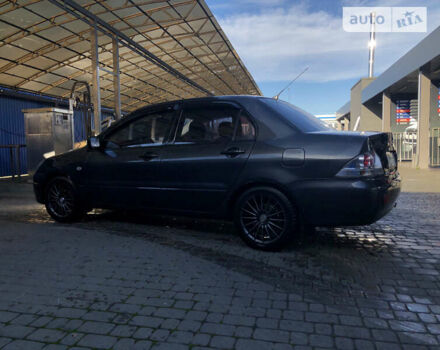 Сірий Міцубісі Lancer, об'ємом двигуна 1.58 л та пробігом 232 тис. км за 2899 $, фото 18 на Automoto.ua