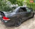 Сірий Міцубісі Lancer, об'ємом двигуна 1.58 л та пробігом 232 тис. км за 3100 $, фото 1 на Automoto.ua