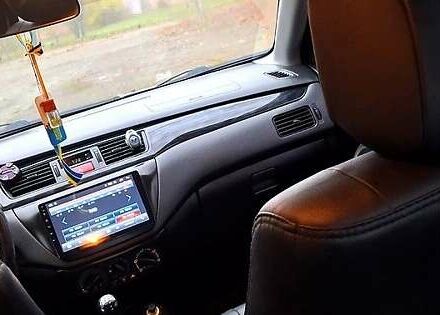Сірий Міцубісі Lancer, об'ємом двигуна 1.6 л та пробігом 213 тис. км за 4400 $, фото 2 на Automoto.ua