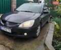 Сірий Міцубісі Lancer, об'ємом двигуна 1.6 л та пробігом 260 тис. км за 2799 $, фото 1 на Automoto.ua