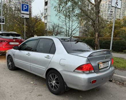 Сірий Міцубісі Lancer, об'ємом двигуна 1.58 л та пробігом 299 тис. км за 3850 $, фото 6 на Automoto.ua