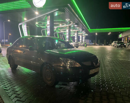 Сірий Міцубісі Lancer, об'ємом двигуна 1.58 л та пробігом 232 тис. км за 2899 $, фото 8 на Automoto.ua