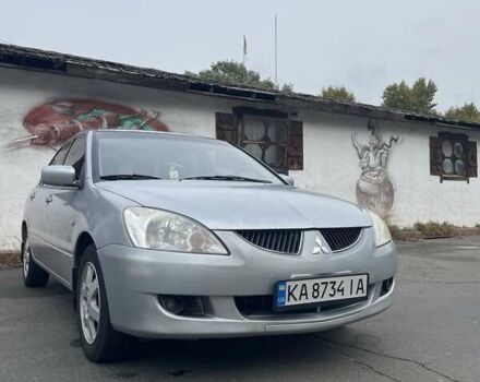 Сірий Міцубісі Lancer, об'ємом двигуна 1.6 л та пробігом 343 тис. км за 3850 $, фото 11 на Automoto.ua