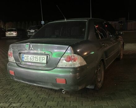 Серый Мицубиси Лансер, объемом двигателя 1.6 л и пробегом 269 тыс. км за 2999 $, фото 3 на Automoto.ua