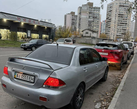 Сірий Міцубісі Lancer, об'ємом двигуна 1.58 л та пробігом 299 тис. км за 3850 $, фото 3 на Automoto.ua