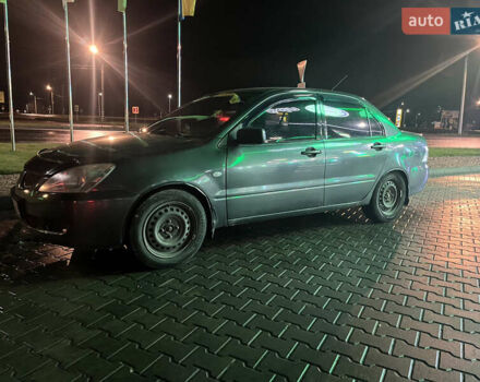 Сірий Міцубісі Lancer, об'ємом двигуна 1.58 л та пробігом 232 тис. км за 2899 $, фото 6 на Automoto.ua