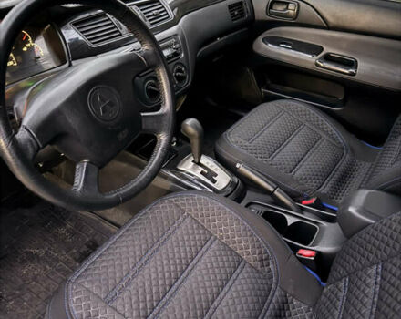 Сірий Міцубісі Lancer, об'ємом двигуна 1.58 л та пробігом 299 тис. км за 3850 $, фото 5 на Automoto.ua