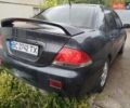 Сірий Міцубісі Lancer, об'ємом двигуна 1.6 л та пробігом 260 тис. км за 2799 $, фото 1 на Automoto.ua