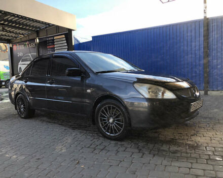 Сірий Міцубісі Lancer, об'ємом двигуна 1.58 л та пробігом 232 тис. км за 2899 $, фото 16 на Automoto.ua