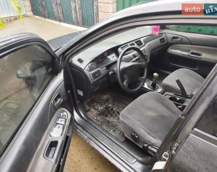 Серый Мицубиси Лансер, объемом двигателя 1.6 л и пробегом 260 тыс. км за 2750 $, фото 8 на Automoto.ua