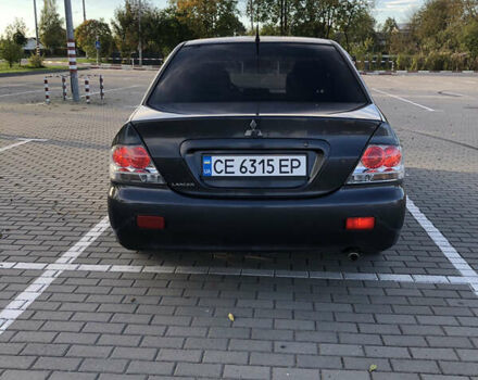 Сірий Міцубісі Lancer, об'ємом двигуна 1.58 л та пробігом 232 тис. км за 2899 $, фото 13 на Automoto.ua