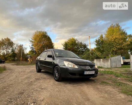 Сірий Міцубісі Lancer, об'ємом двигуна 1.58 л та пробігом 232 тис. км за 2899 $, фото 22 на Automoto.ua