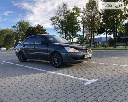 Сірий Міцубісі Lancer, об'ємом двигуна 1.58 л та пробігом 232 тис. км за 2899 $, фото 9 на Automoto.ua