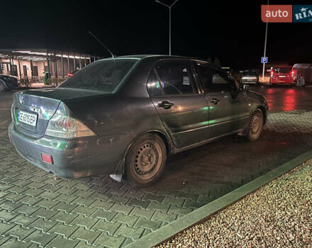 Сірий Міцубісі Lancer, об'ємом двигуна 1.58 л та пробігом 232 тис. км за 2899 $, фото 7 на Automoto.ua