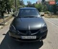 Серый Мицубиси Лансер, объемом двигателя 1.6 л и пробегом 250 тыс. км за 3800 $, фото 1 на Automoto.ua