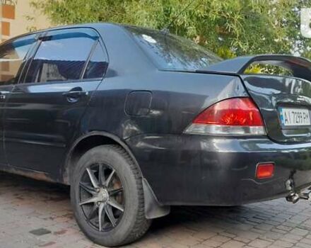 Сірий Міцубісі Lancer, об'ємом двигуна 1.58 л та пробігом 238 тис. км за 2800 $, фото 4 на Automoto.ua