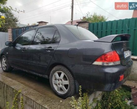 Серый Мицубиси Лансер, объемом двигателя 1.6 л и пробегом 260 тыс. км за 2750 $, фото 1 на Automoto.ua