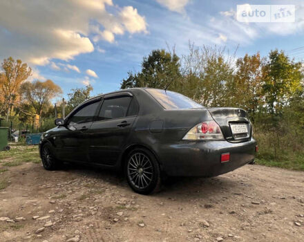 Сірий Міцубісі Lancer, об'ємом двигуна 1.58 л та пробігом 232 тис. км за 2899 $, фото 24 на Automoto.ua
