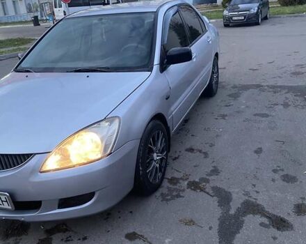 Мицубиси Лансер 2003 в Белой Церкве на Automoto.ua Серый Мицубиси Лансер, объемом двигателя 1.58 л и пробегом 350 тыс. км за 3300 $, фото 1 на Automoto.ua