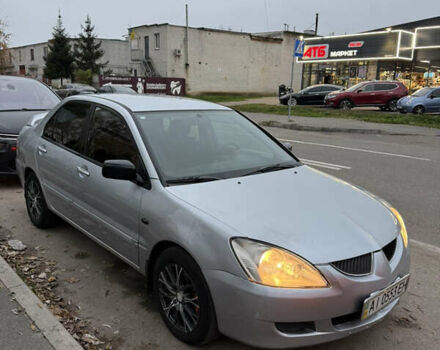 Сірий Міцубісі Lancer, об'ємом двигуна 1.58 л та пробігом 299 тис. км за 3850 $, фото 1 на Automoto.ua