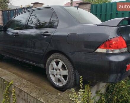 Сірий Міцубісі Lancer, об'ємом двигуна 1.6 л та пробігом 260 тис. км за 2799 $, фото 9 на Automoto.ua