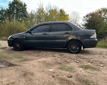 Сірий Міцубісі Lancer, об'ємом двигуна 1.58 л та пробігом 232 тис. км за 2899 $, фото 19 на Automoto.ua