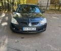 Сірий Міцубісі Lancer, об'ємом двигуна 1.6 л та пробігом 324 тис. км за 4200 $, фото 1 на Automoto.ua